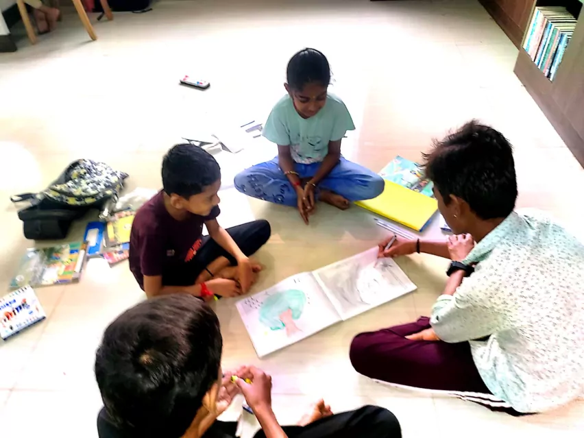 Children from different hamlets doing an activity together